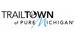 trailtown text in black logo with blue m on white background