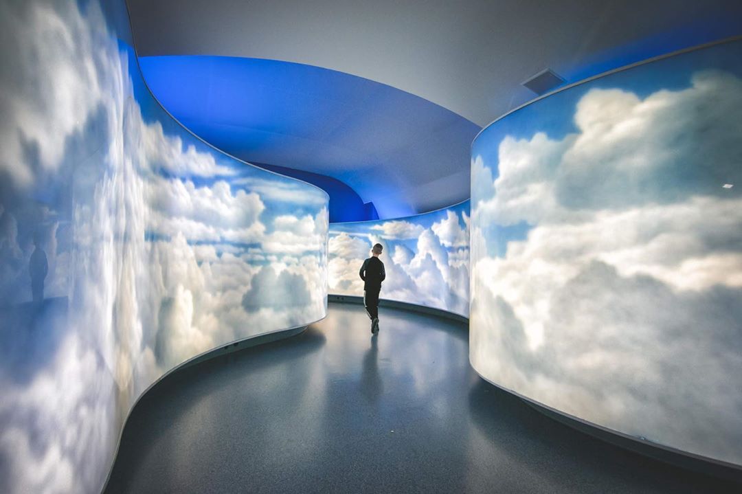 Air Zoo in Kalamazoo A boy running through cloud mural at the Air Zoo