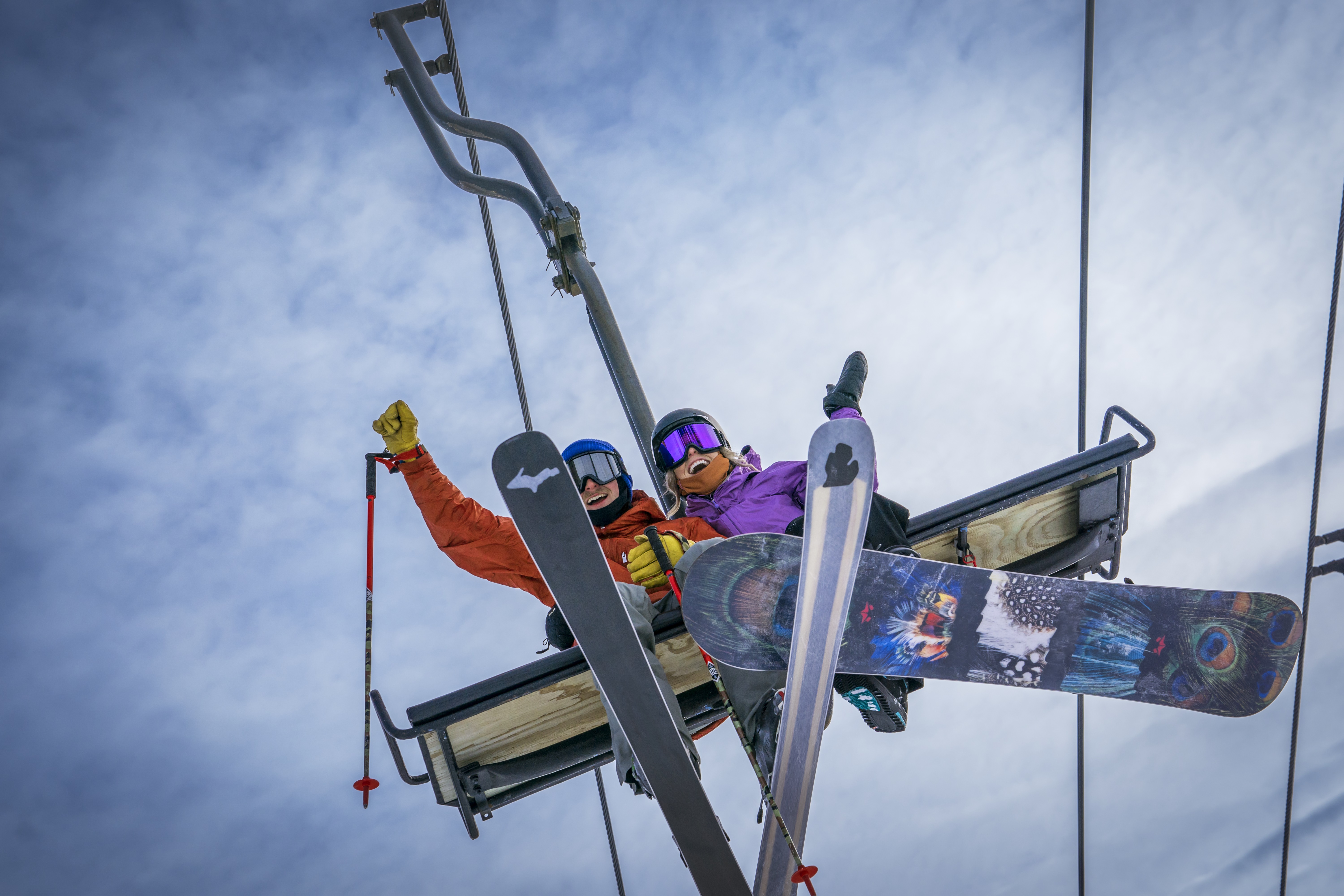 The Highlands at Harbor Springs A man and woman riding a ski lift