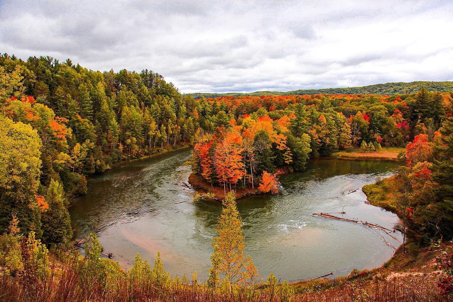 Manistee River Manistee River flowing through a forest during fall