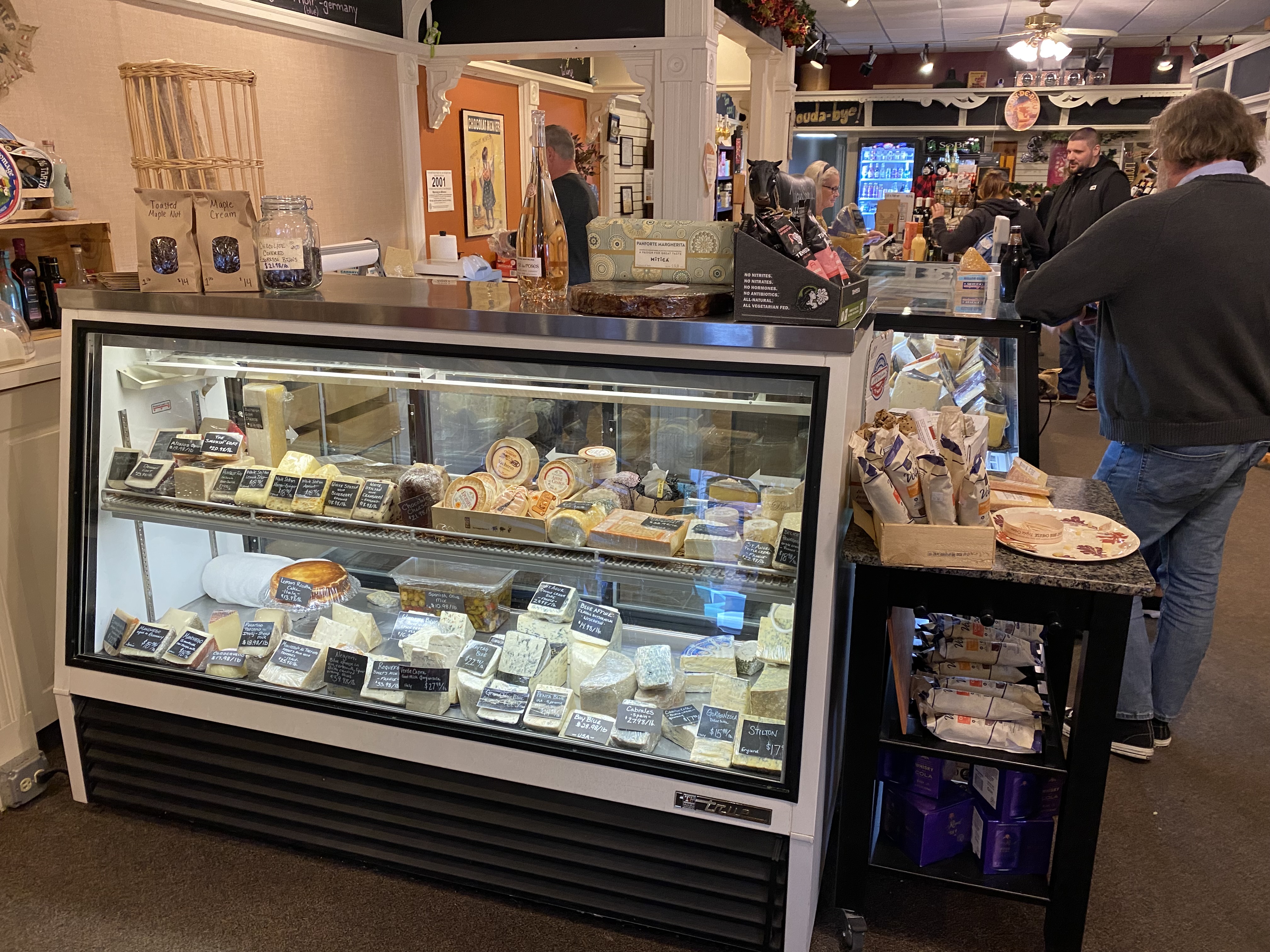The Boulevard Market Cooler display case of cheese products in a store