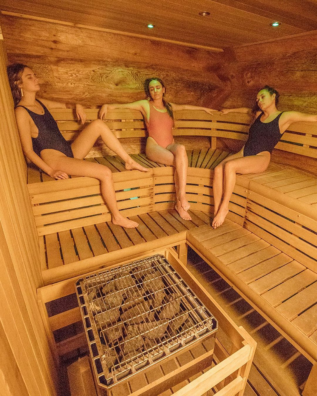 Nordic Spa at Mount Bohemia Three women sitting in a sauna