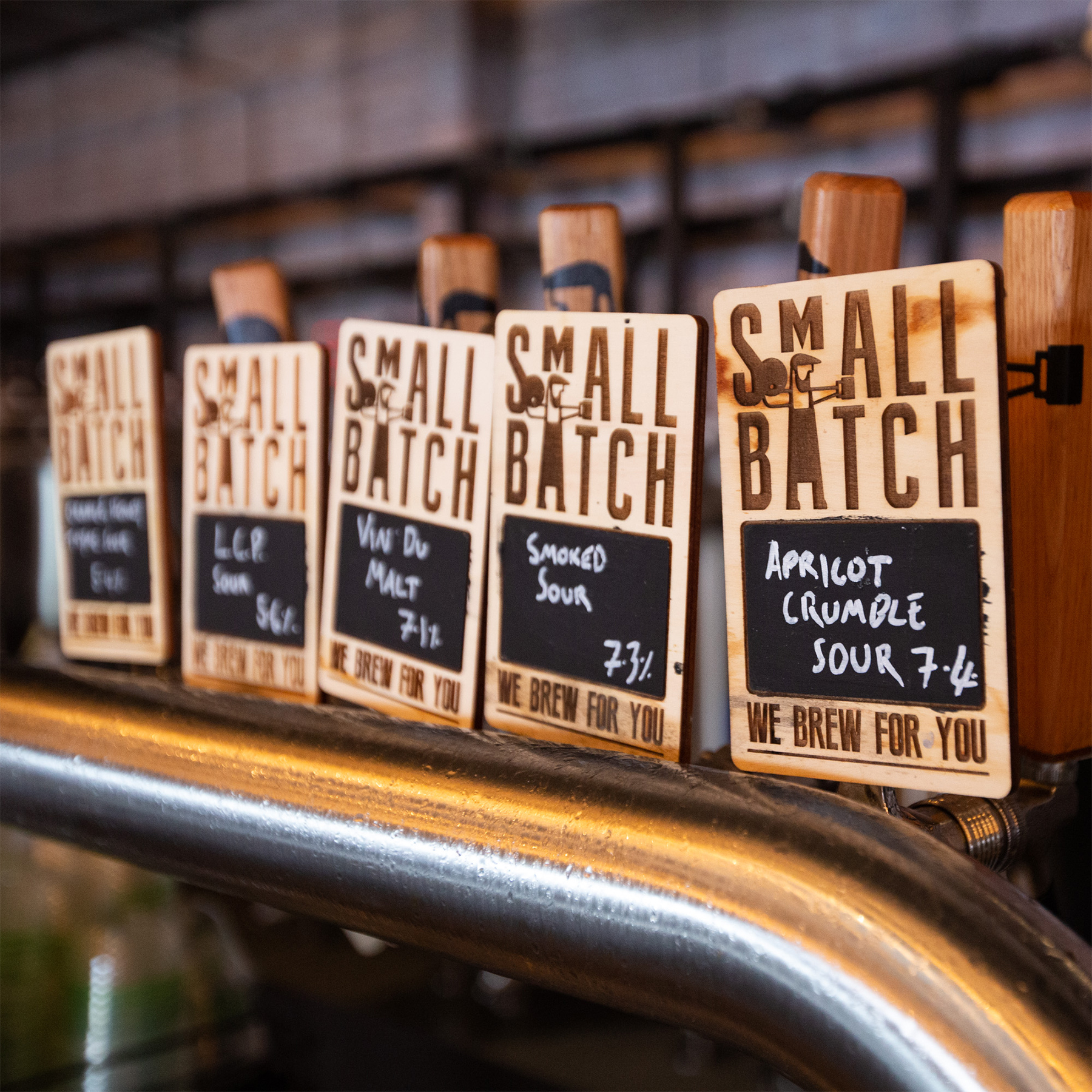 Beer flavors written on chalkboard signs