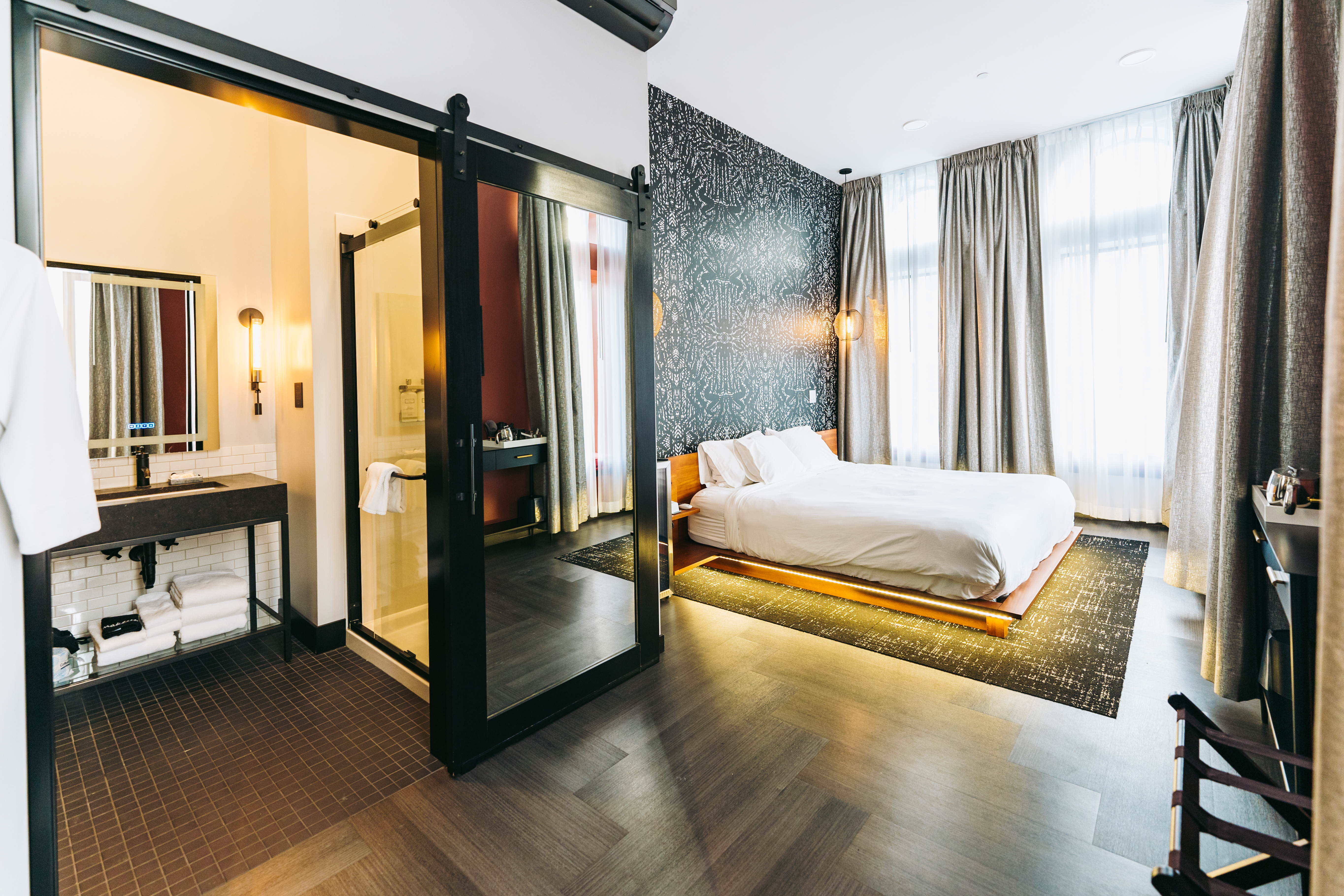 A hotel room with one large bed
