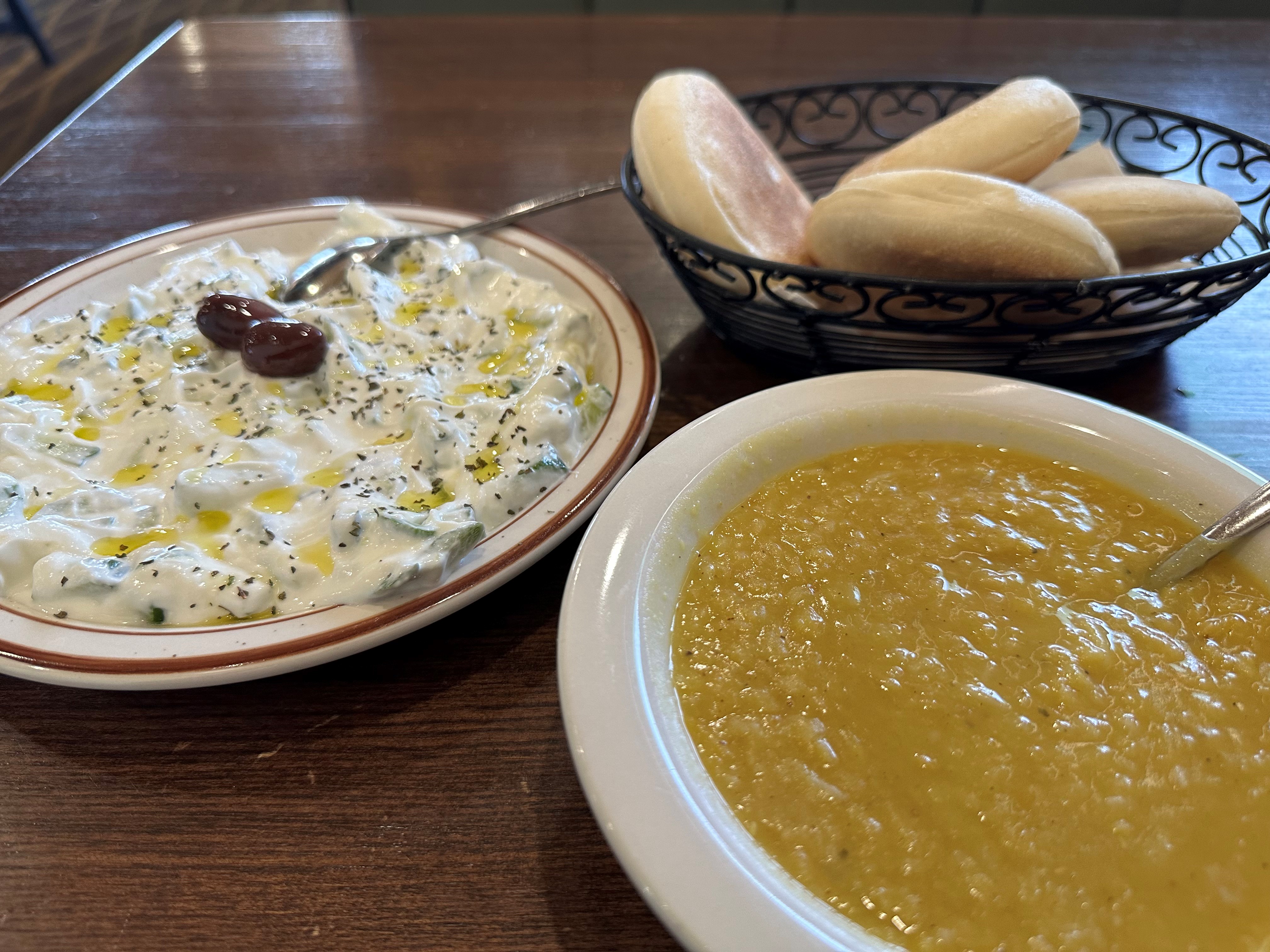 Sahara Restaurant & Grill A bowl of lentil soup and basket of bread on a table