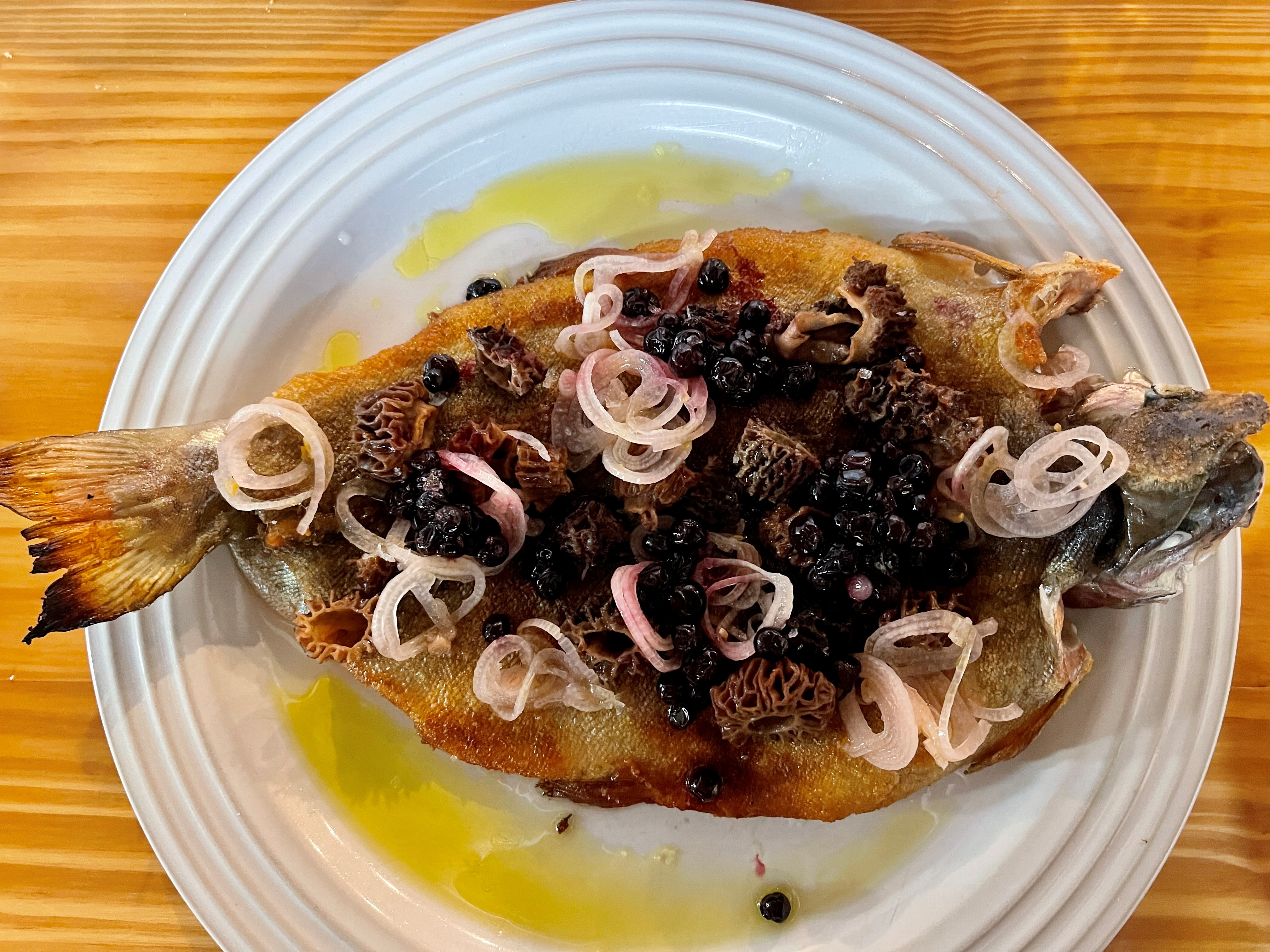 Cafe Mamo A cooked fish with morel mushrooms and onions