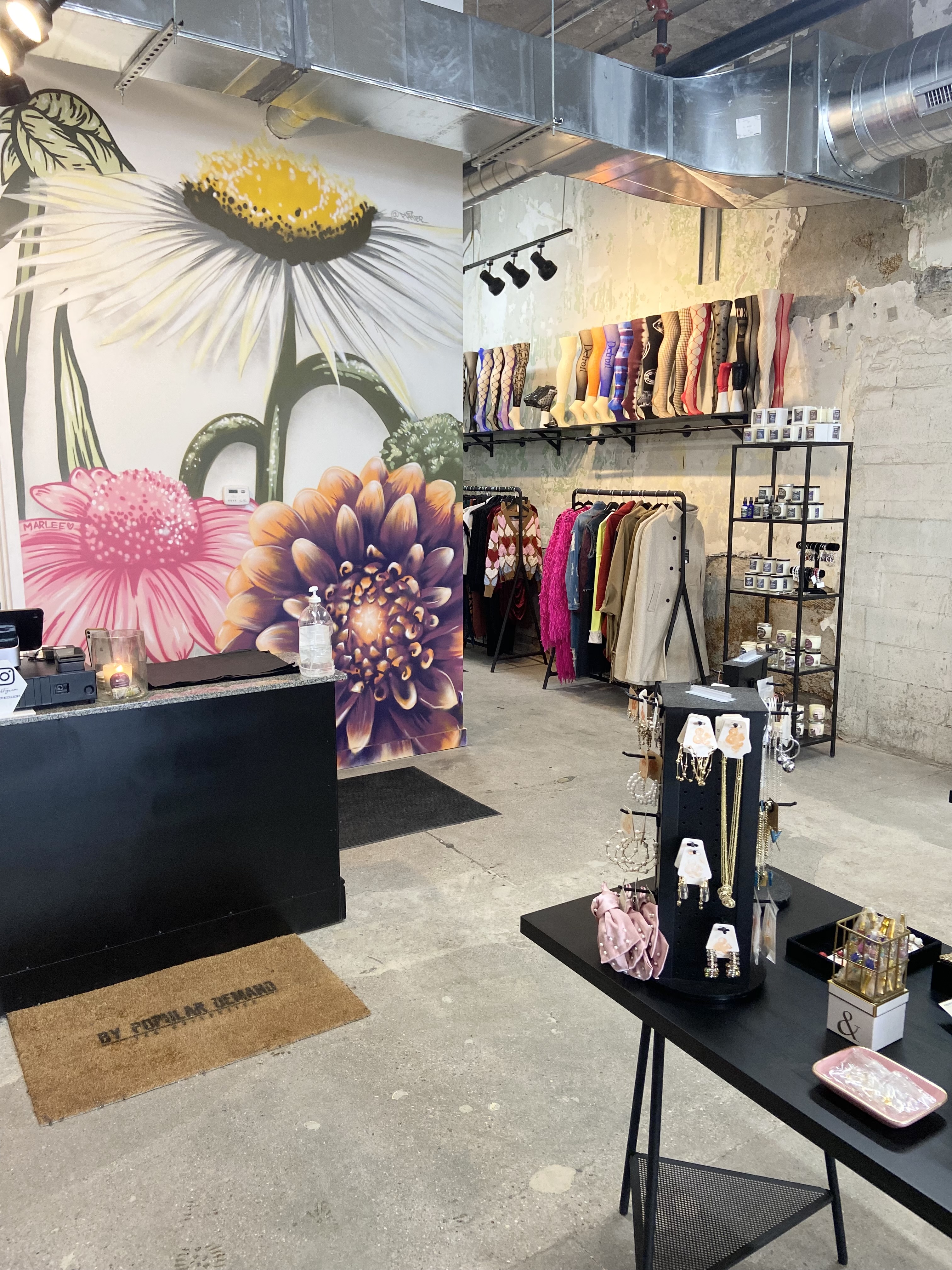 Interior of a retail store with a jewelry display on a table. 
