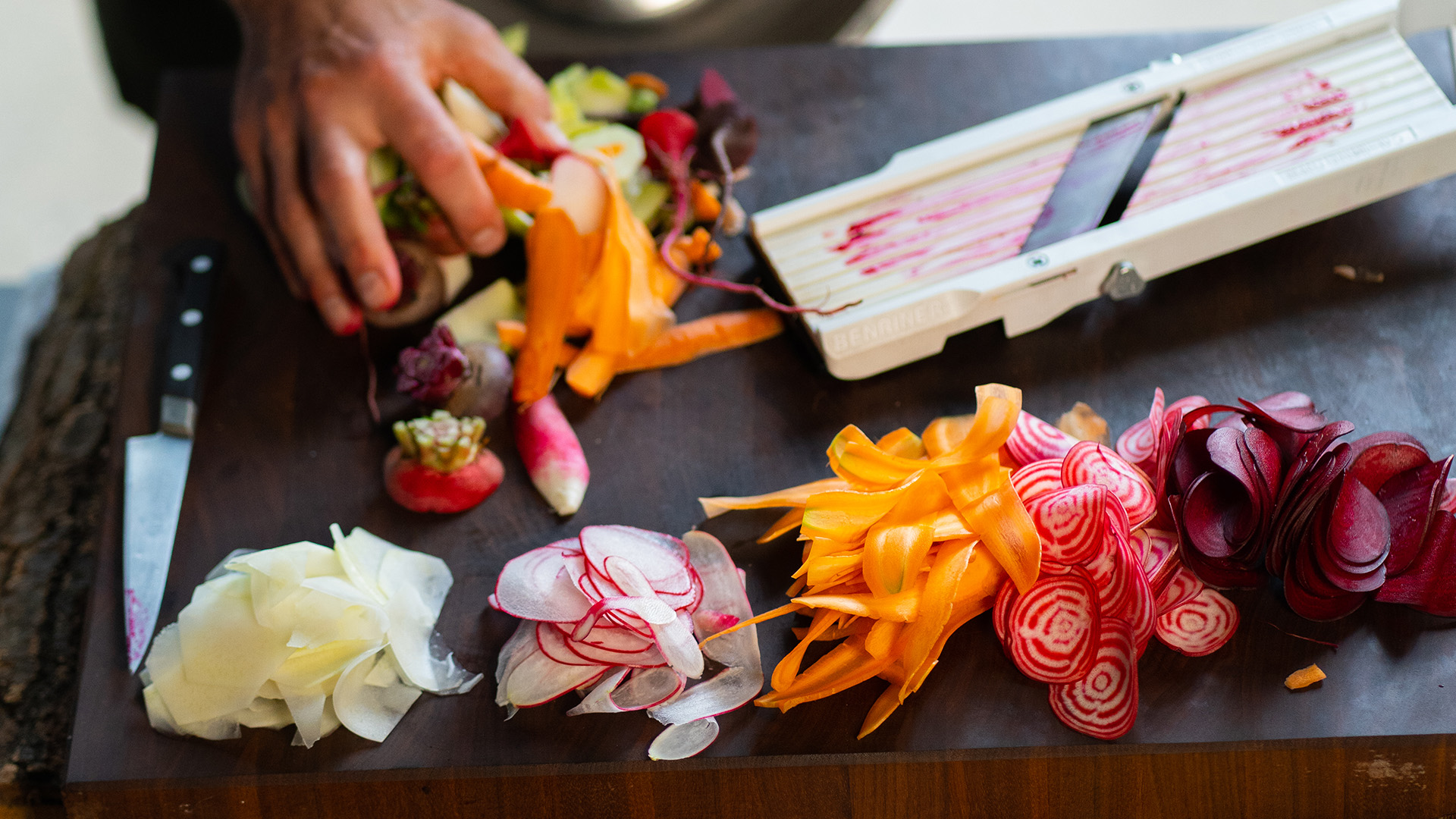 Selden Standard Sliced vegetables on a cutting board.