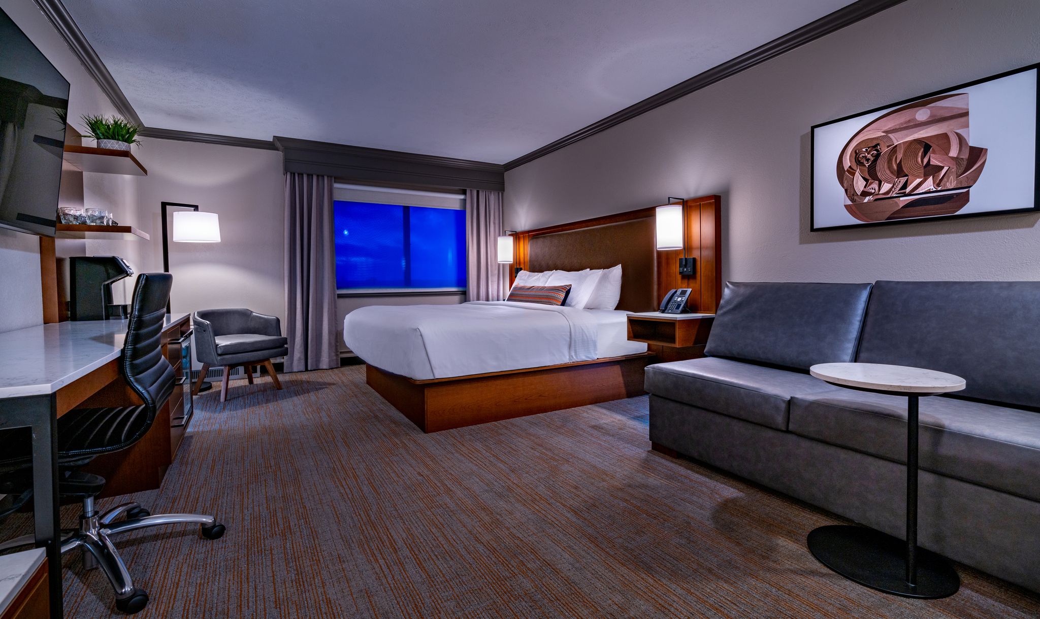 Hotel Remodel | Photo Courtesy of Grand Traverse Resort and Spa Interior of a hotel suite with a King size bed