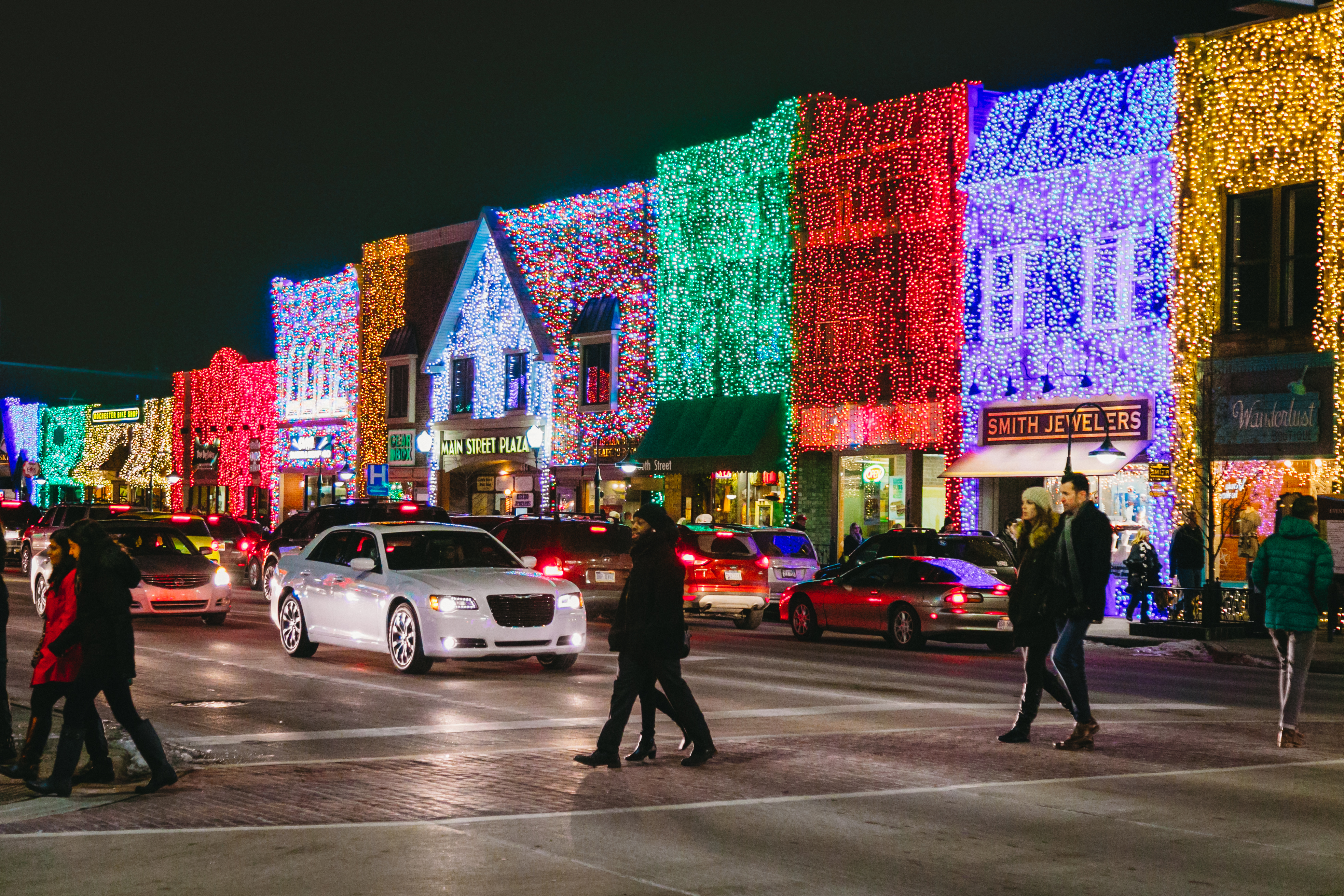Big, Bright Light Show in Rochester People walking in downtown Rochester decorated with holiday lights