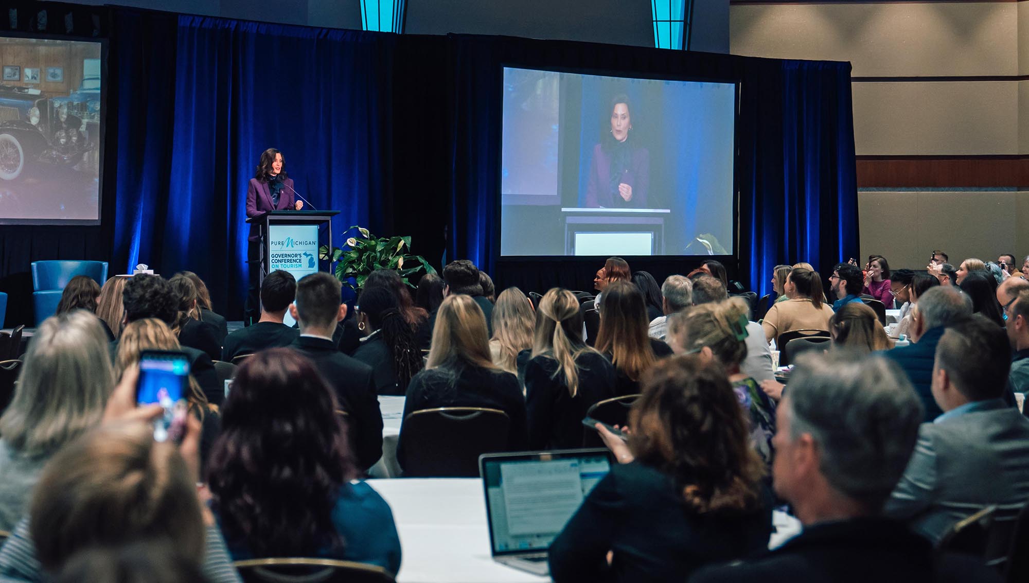Governor Gretchen Whitmer Governor Gretchen Whitmer speaking on stage at the Pure Michigan Governor's Conference on Tourism