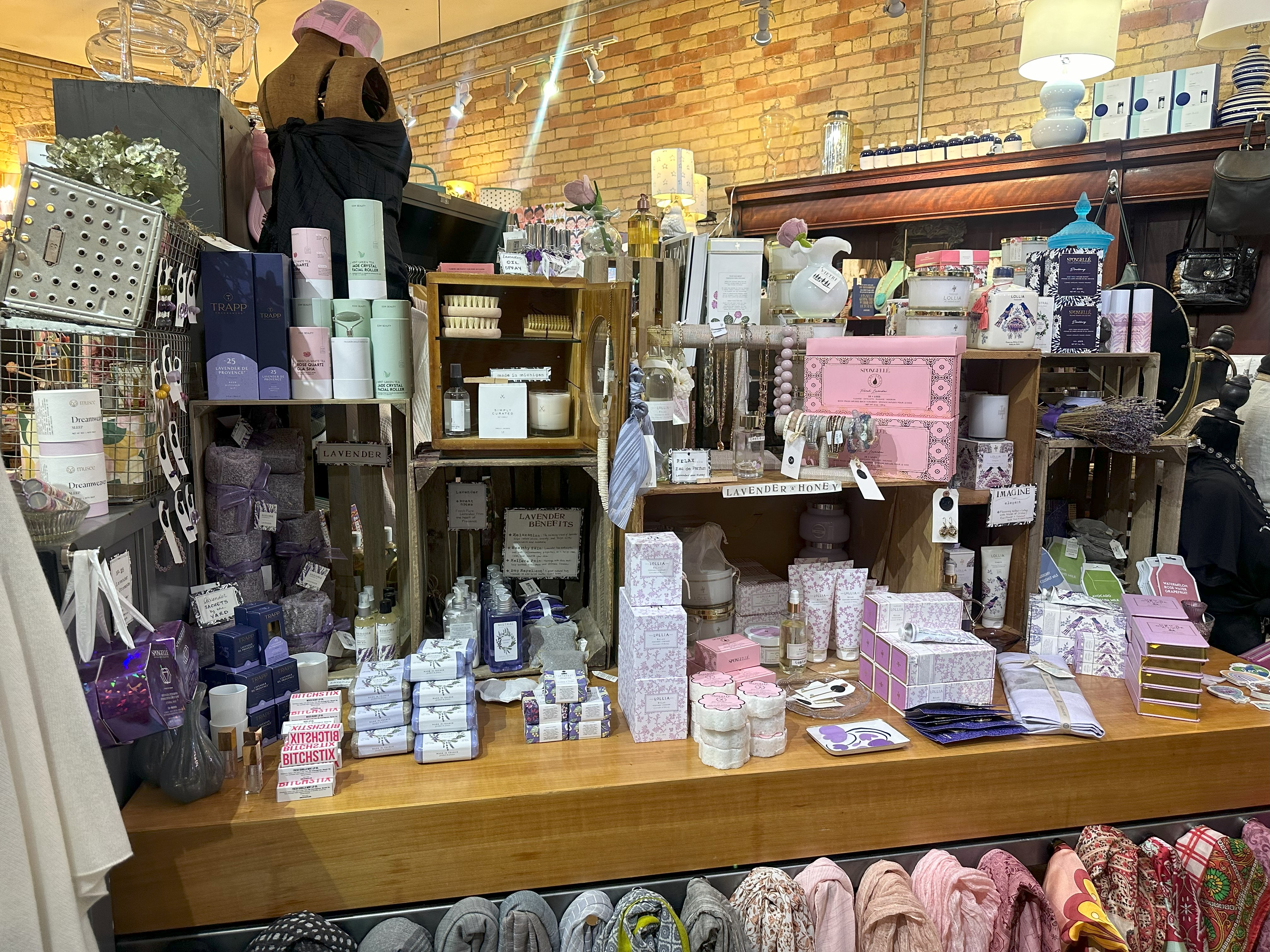 A soap and home goods display in a store. 