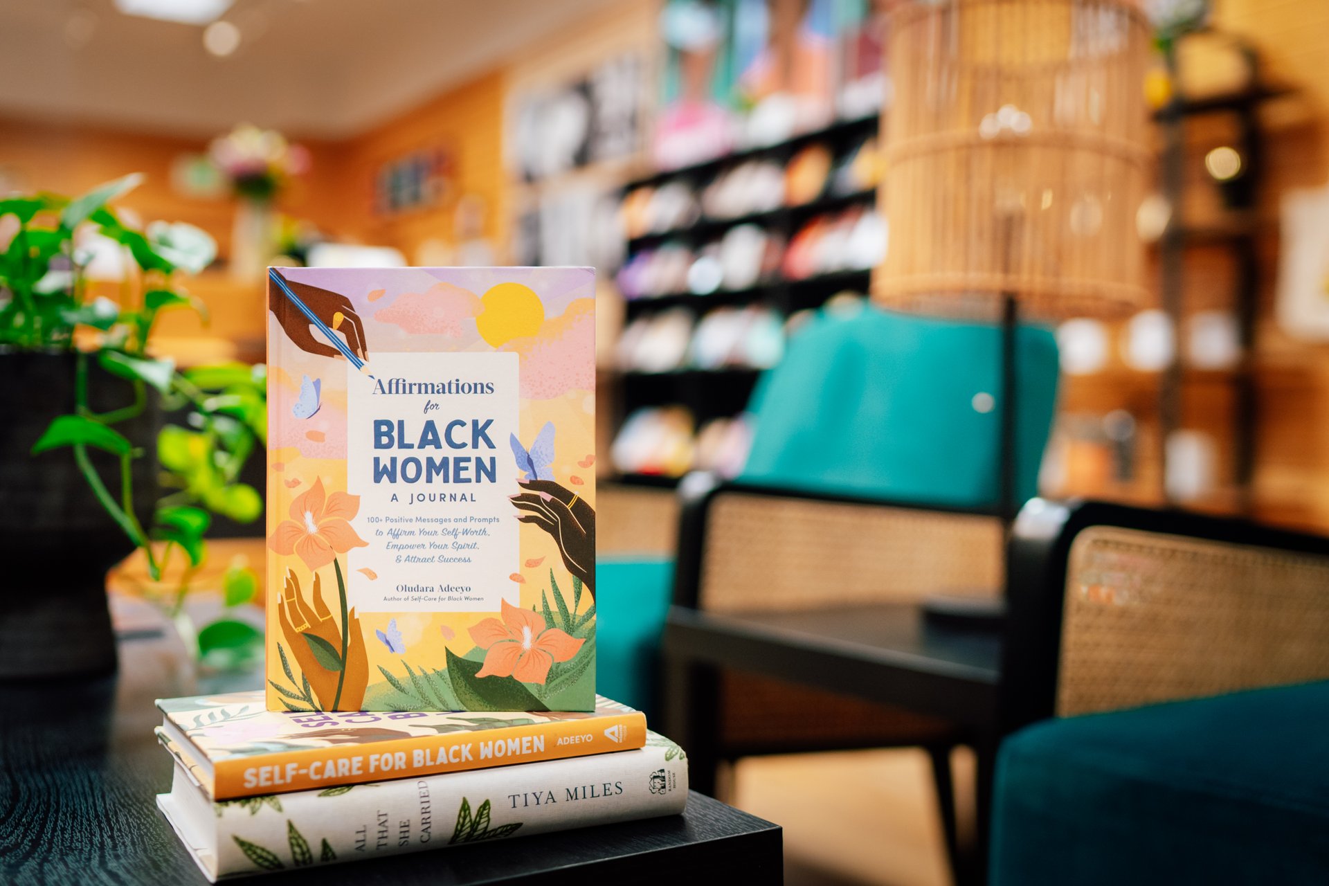 A book on display beside reading chairs. 