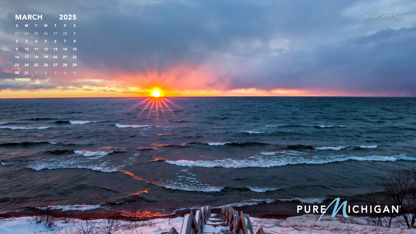2025 Pure Michigan Calendar | March Photo of Great Sand Bay with a graphic of Calendar for March 2025.