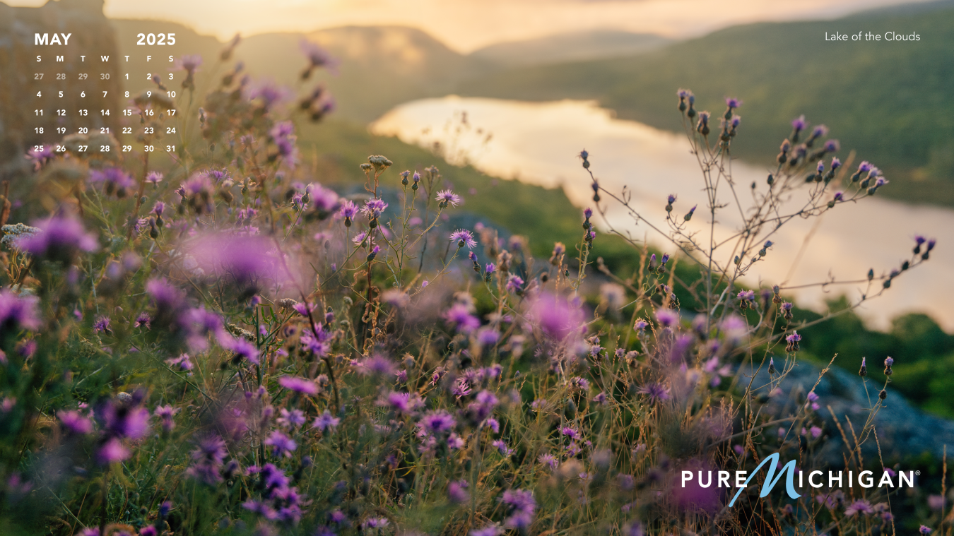 2025 Pure Michigan Calendar | May Lake of the Clouds with a graphic of the calendar month of May overlayed.