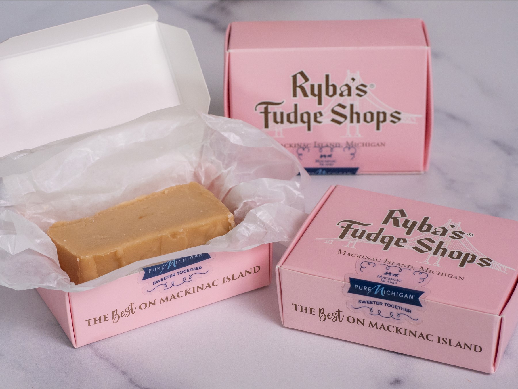 Three boxes of Sweet Maple Waffle fudge slices.