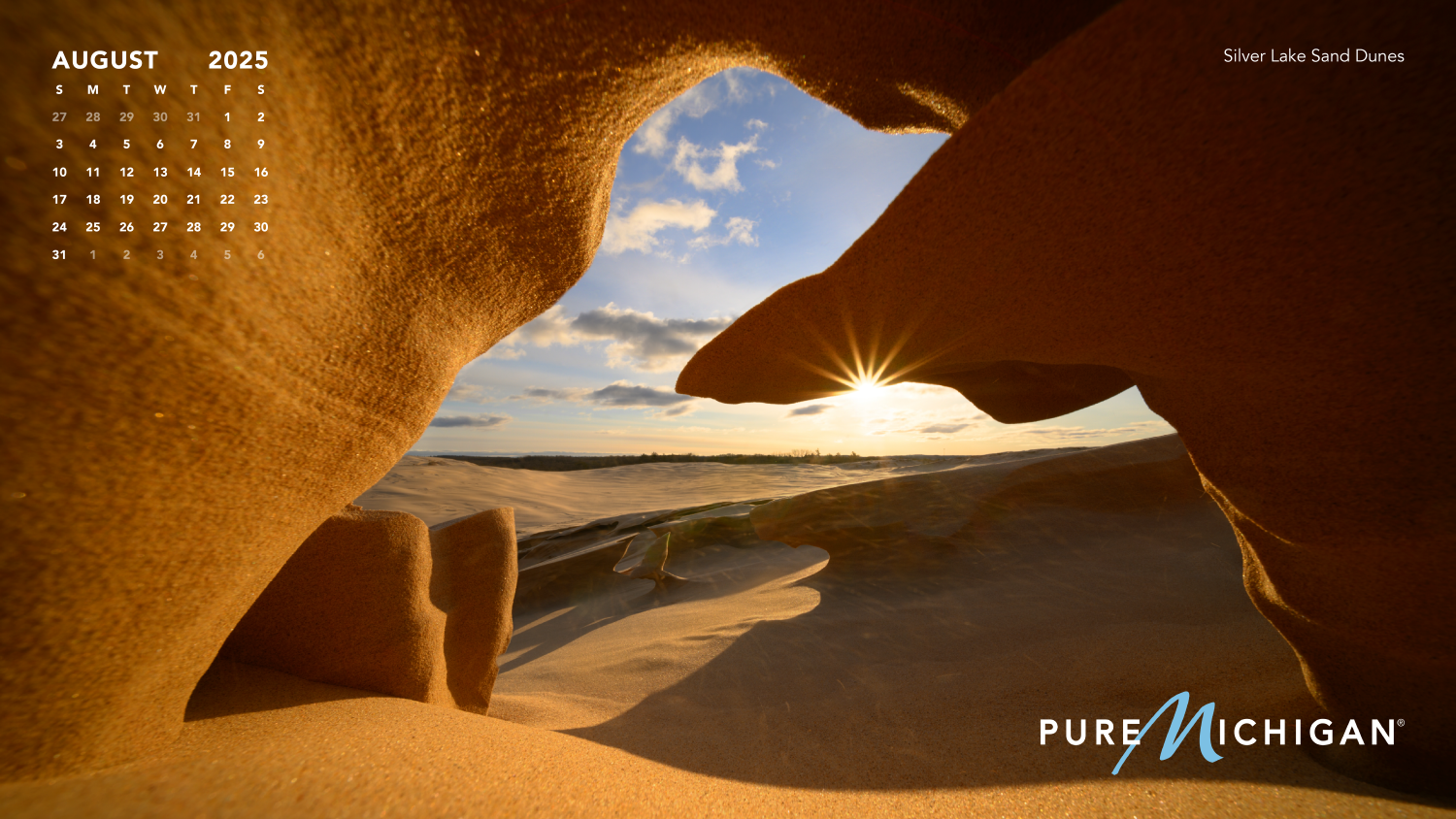 2025 Pure Michigan Calendar - August An August 2025 calendar graphic on an image of sand dunes.