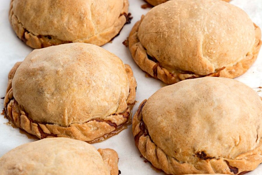 Pasties on a parchment paper.