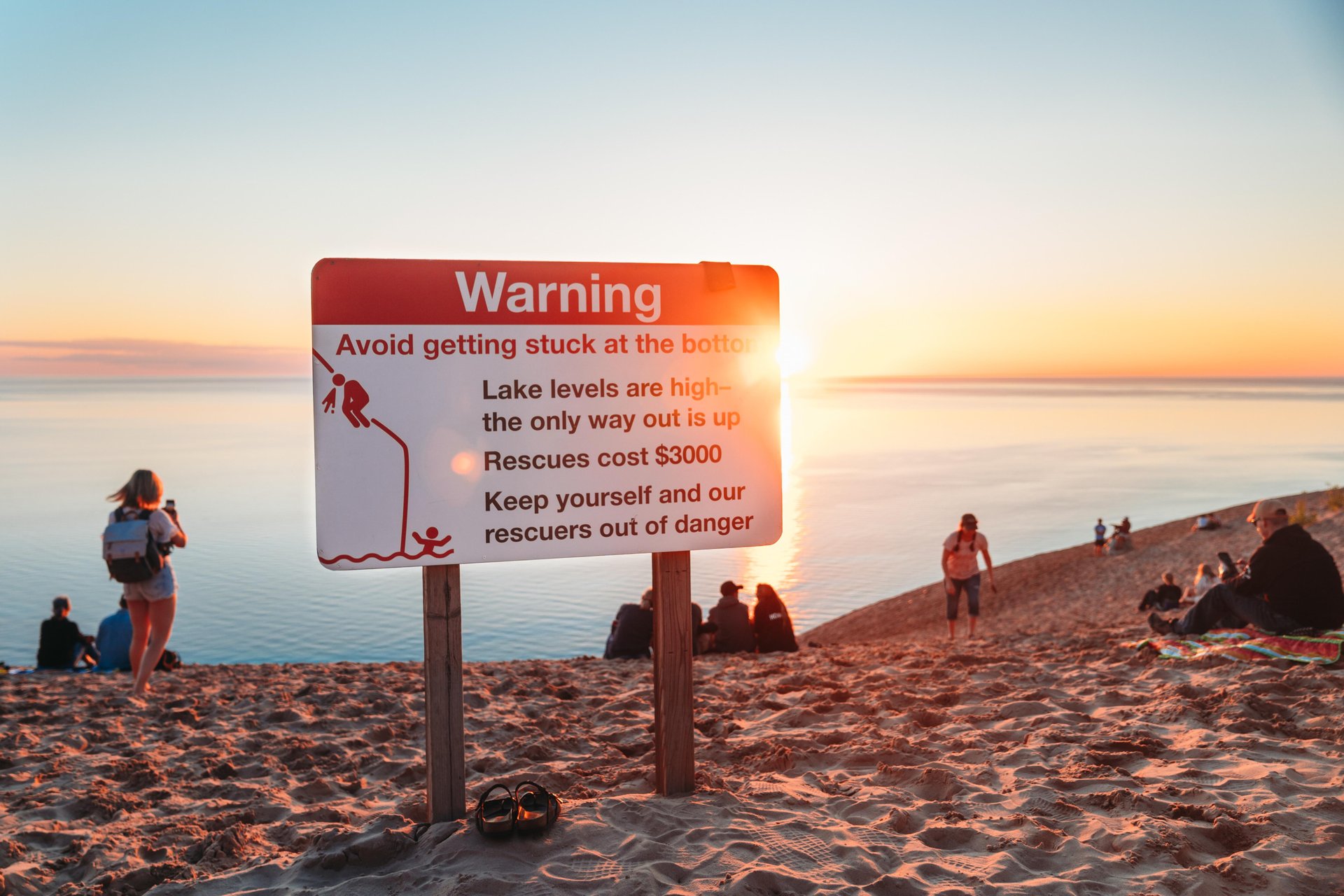Safety signage warning about dune climbing at Sleeping Bear dunes National Lakeshore.
