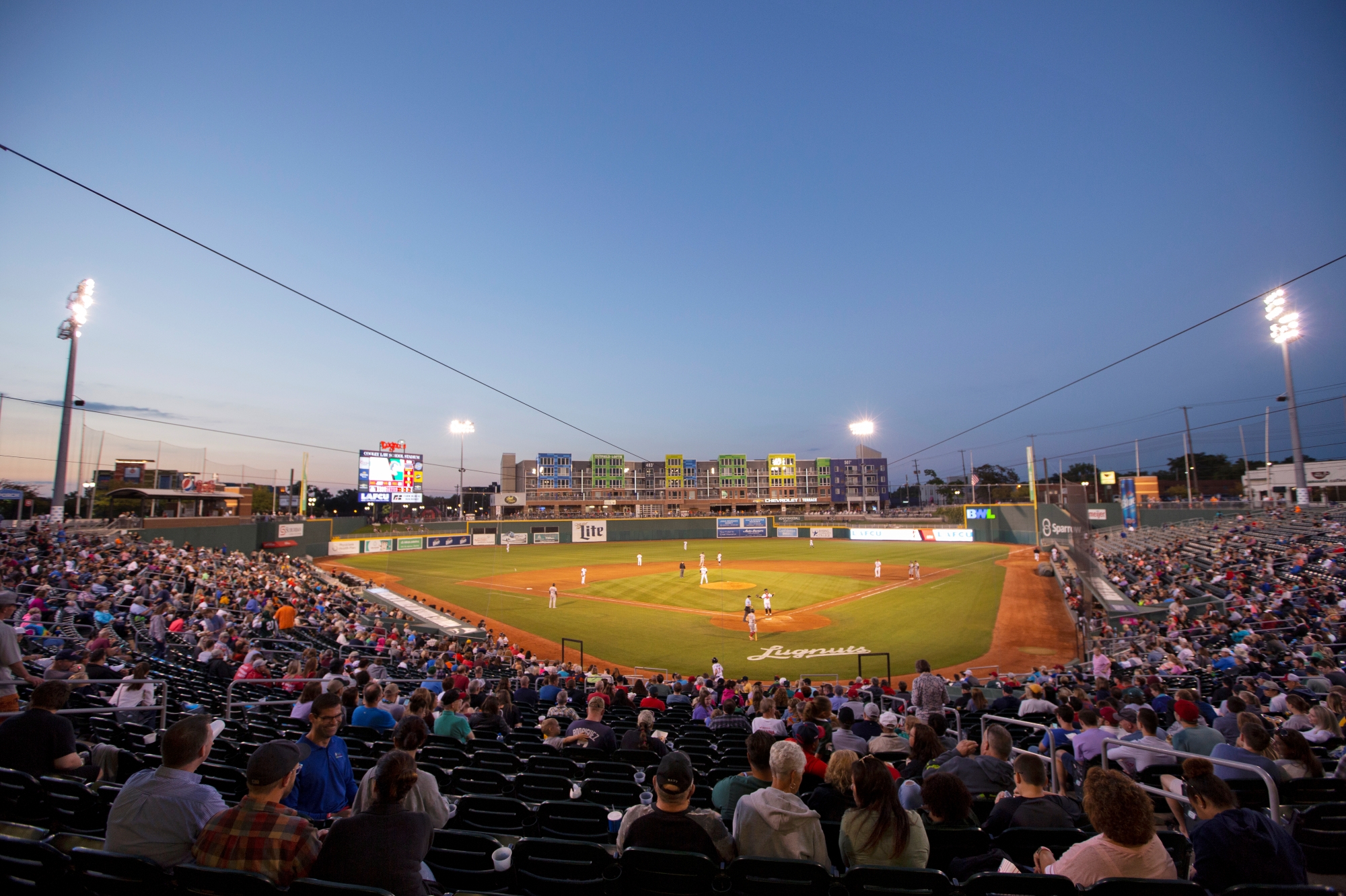 Spectators watching a Lugnuts baseball game in downtown Lansing.