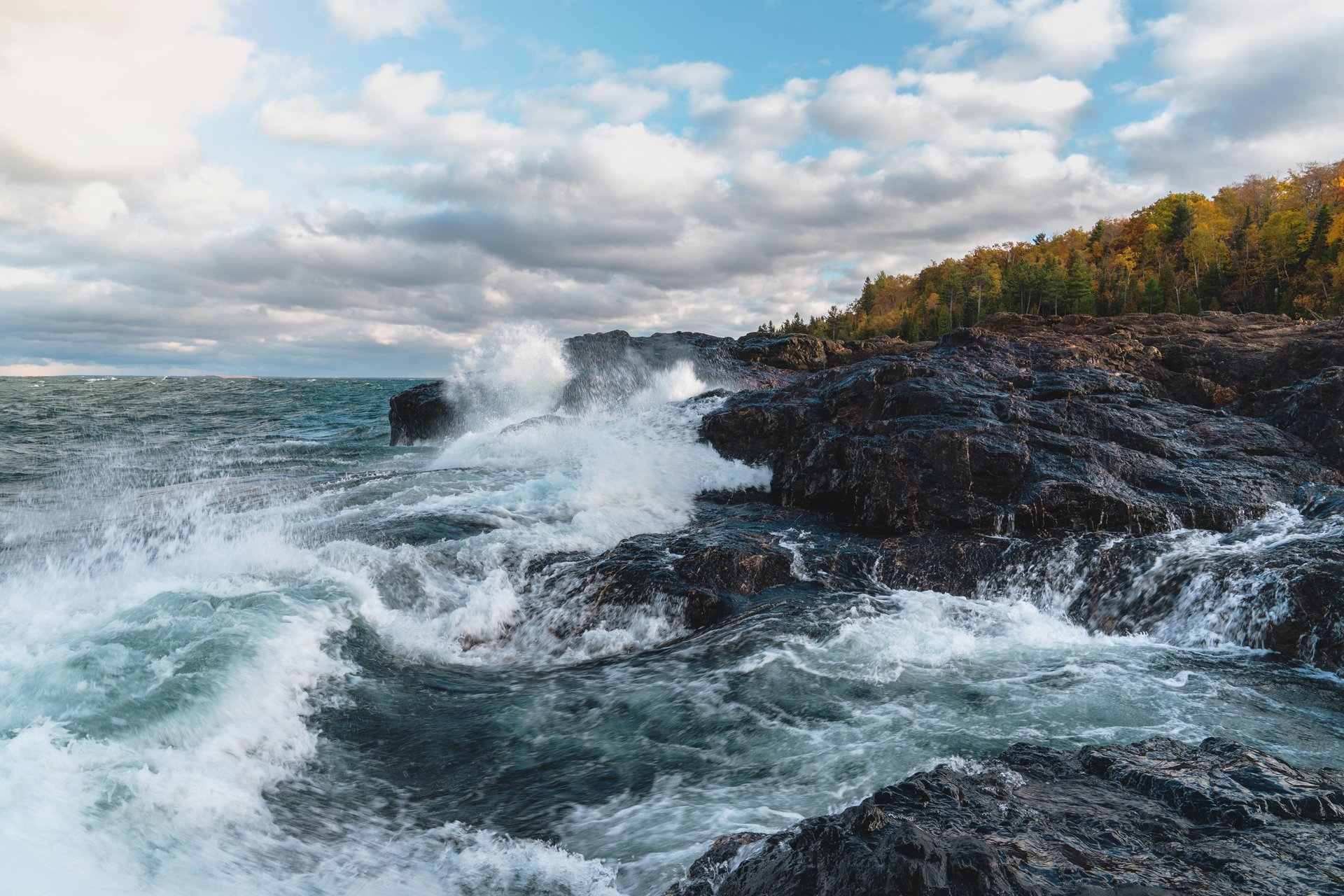 Waves on volcanic rock formations along the Lake Superior coast.