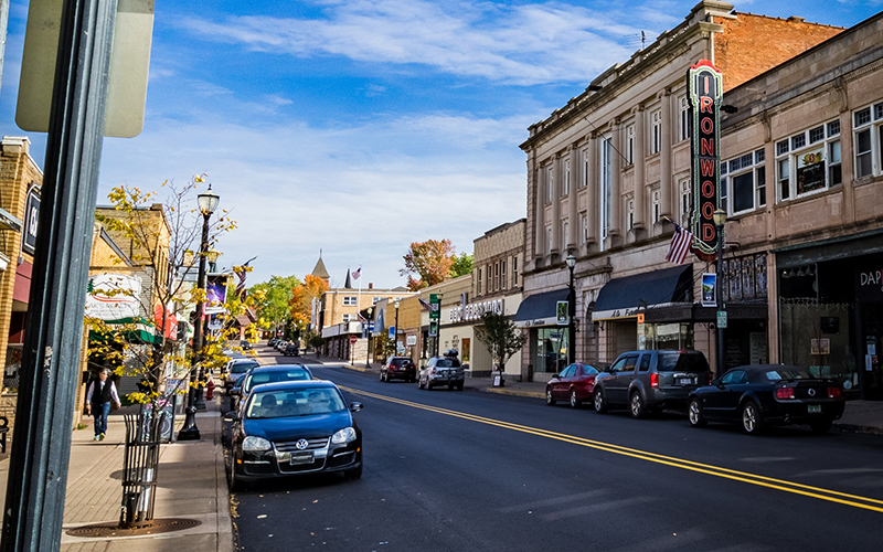 view of downtown on a sunny day, cars in the street