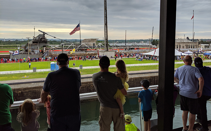 families watching the freighters from inside the visitor center