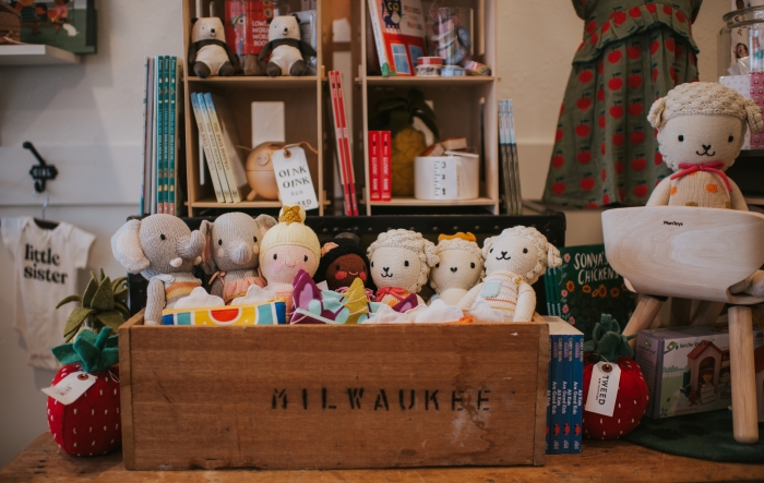 Box of plush toys at Tweed Baby. 