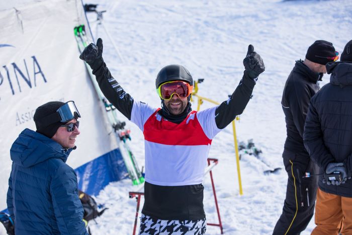 Nick Baumgartner celebrating after snowboarding