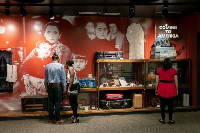 Visitors looking at an exhibit at the Arab American Museum.