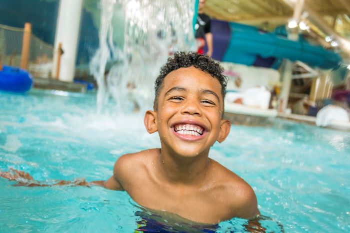 A child in the water at Avalanche Bay.