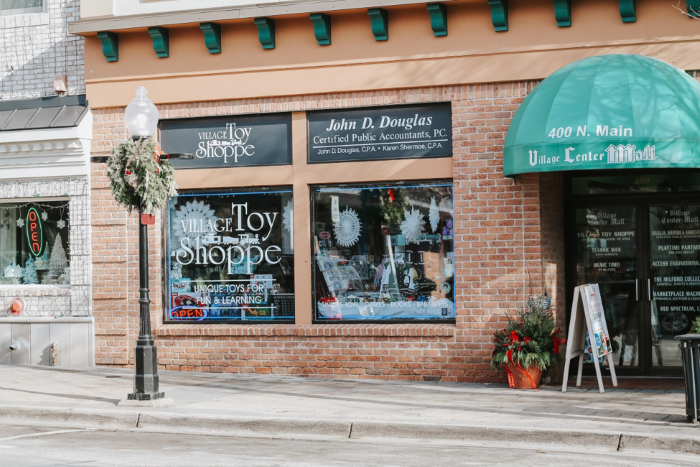 The Village Toy Shoppe storefront decorated for Christmas