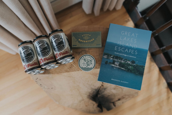 A six pack of beer, a sticker, and a book.