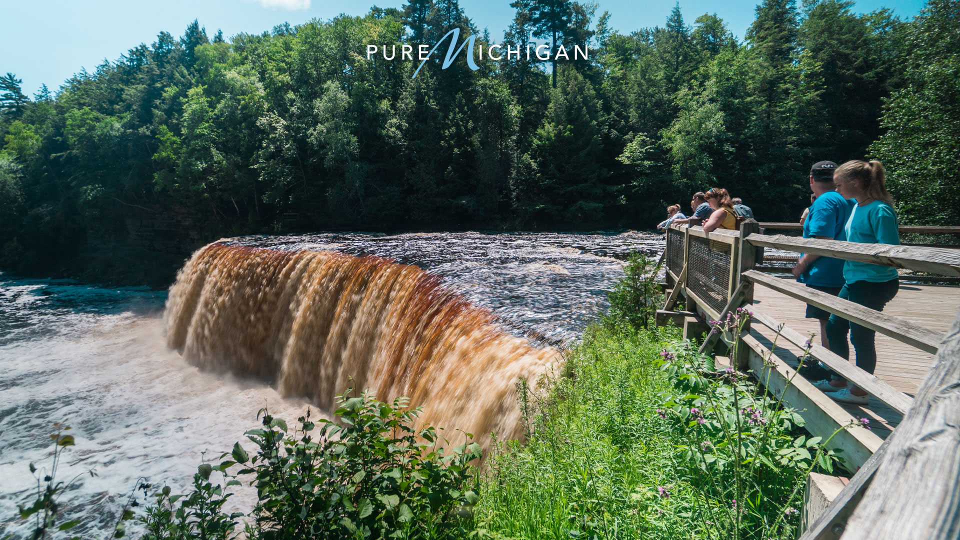 People on observation deck beside Tahquamenon Falls