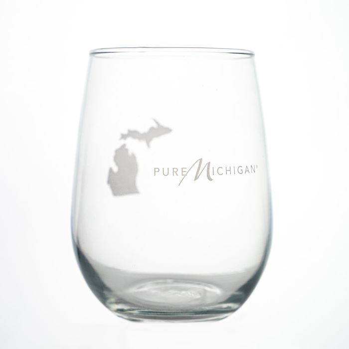 A wine glass with the Pure Michigan logo etched on the glass.