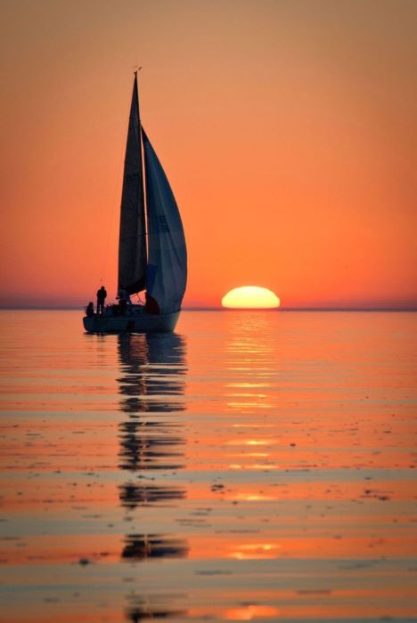 Sail boat at sunset on lake michigan
