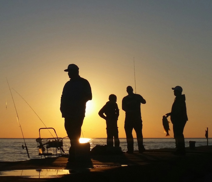 Fishing off the pier of St. Joseph Lighthouse