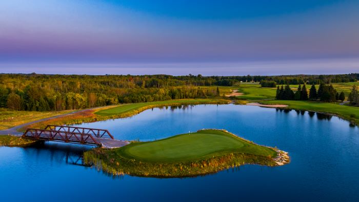 Water feature at sunset on golf course at Sweetgrass