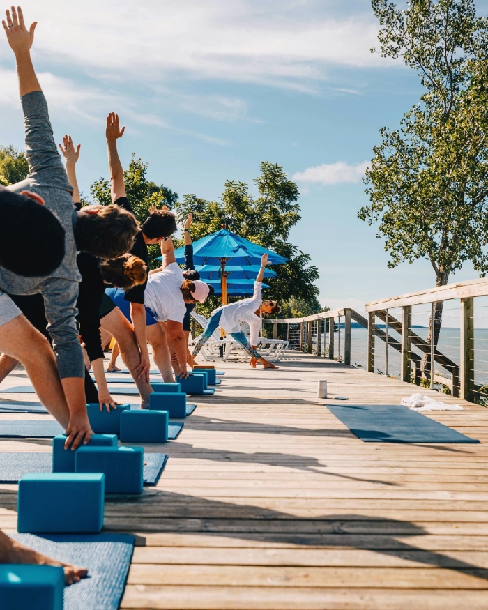 Students practicing yoga on deck at Lakeshore Resort.