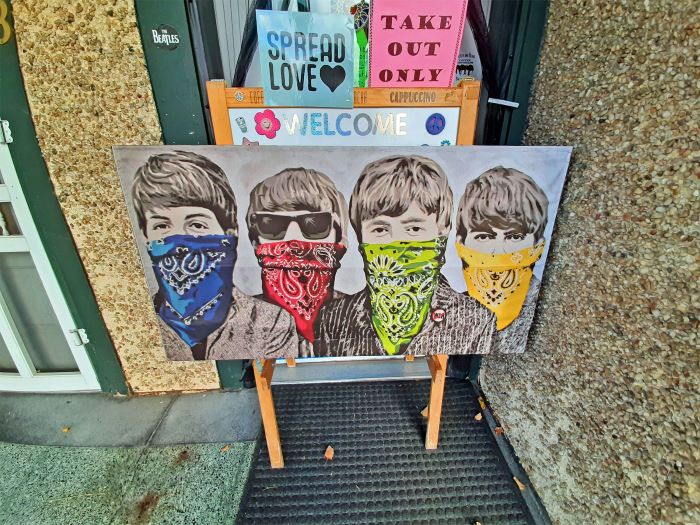 Sign of the Beatles band in bandanas outside Beatles and Beans Coffee Emporium