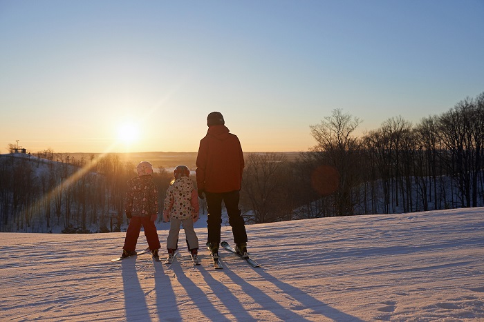 Dad and Daughters Skiing