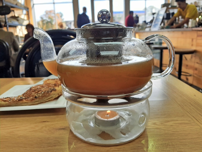 Pot of tea and a pastry at Qahwah House
