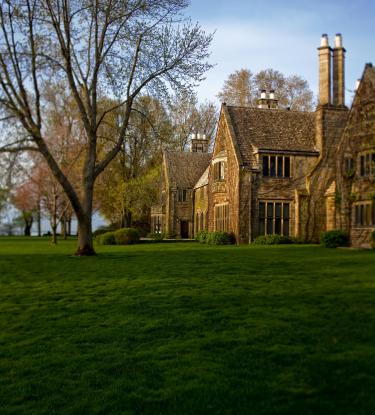 view of the home of Edsel & Eleanor Ford, large brick home with many peaks