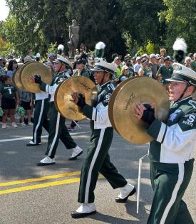 msu marching band at a parade performance - showing the cymbals section