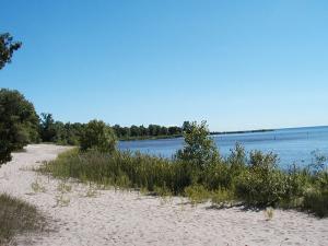 Sandy shoreline on Green Bay at Wells State Park Photo