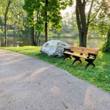 Bench on Riverwalk Trail along Grand River in Jaycee Park Photo