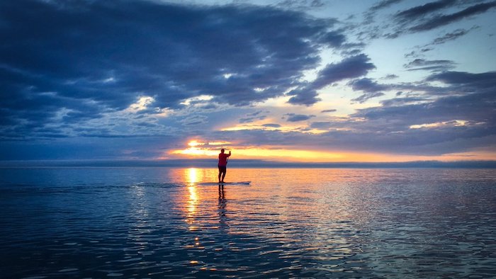 Stand-up paddleboarding on Lake Michigan in Good Hart