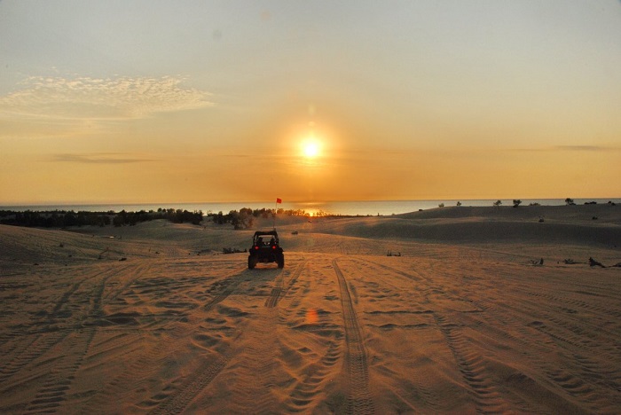 An ATV driving on the sand dunes at Silver Lake