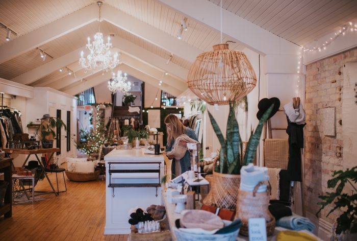 Interior of Spring Sweet with clothing selections and displays of home decor.