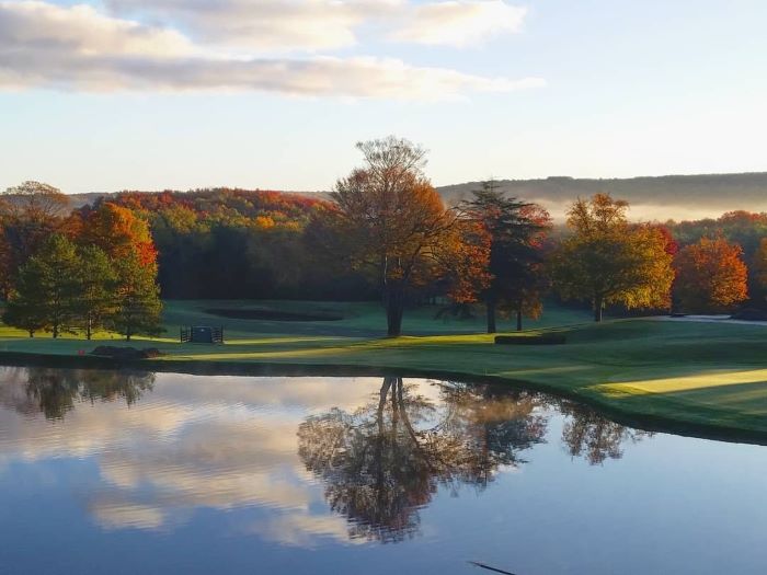 Golf course by pond at Boyne Highlands